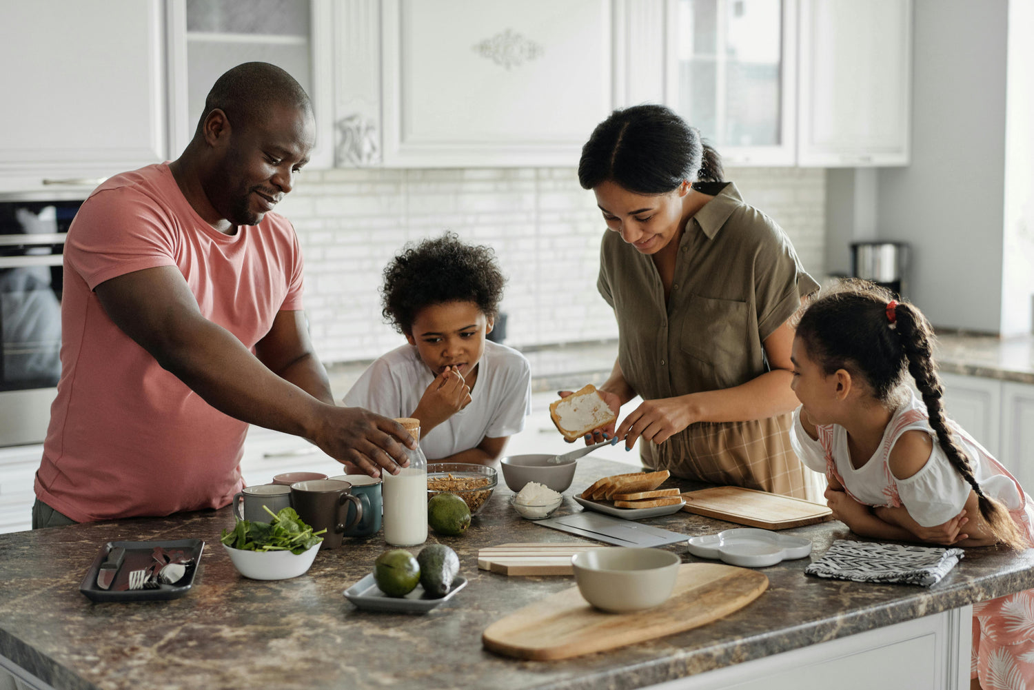 family smiling together and having breakfast